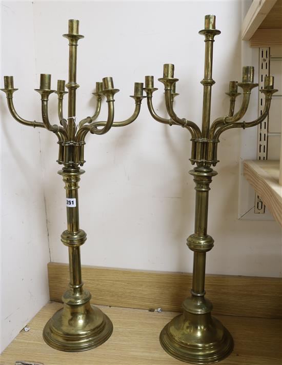 A pair of Victorian brass seven-light candlesticks, H 82cm